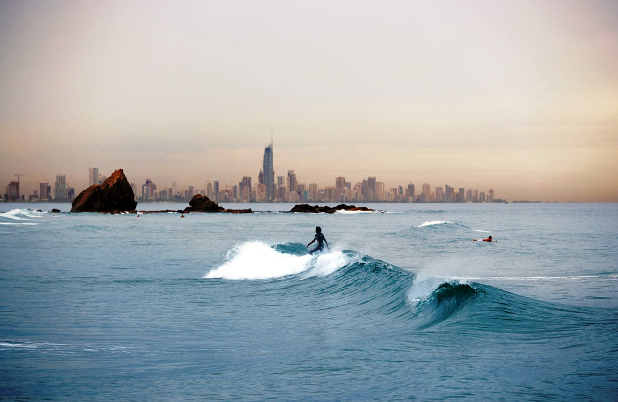 student surfing after classes at Bond University