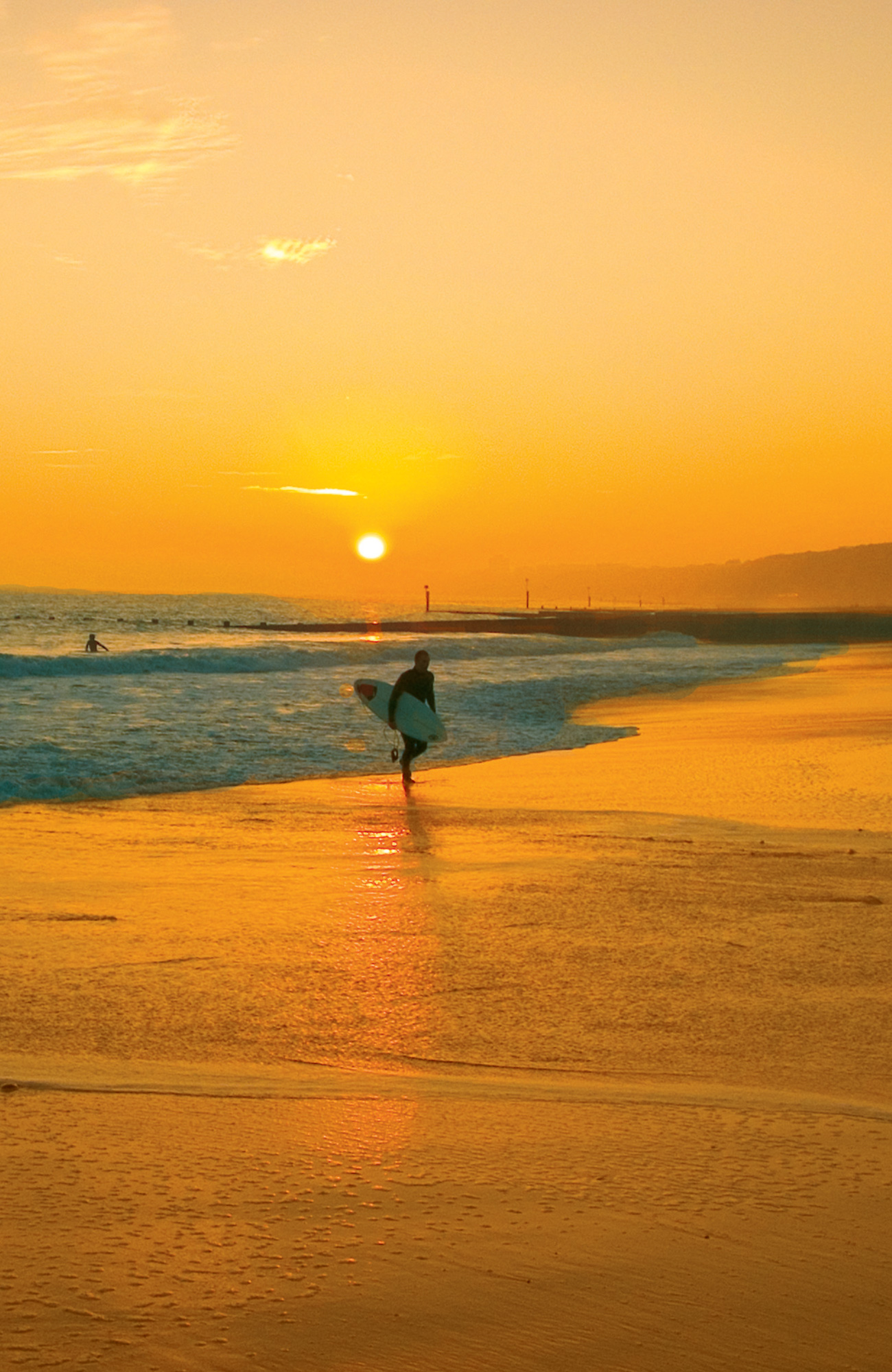 a boy surfing outside bournemouth university