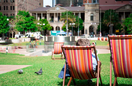 a student is chilling in a park in brisbane in australia