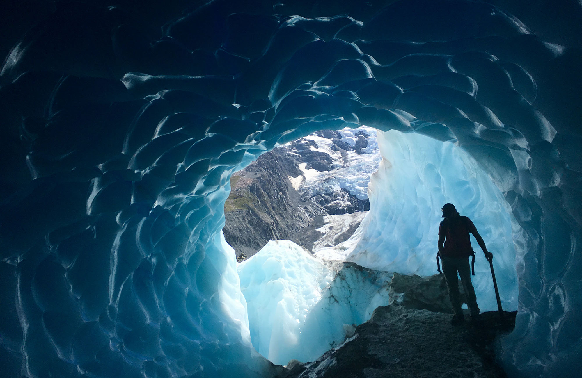 Hiking in an ice cave at the Tasman Glacier in New Zealand