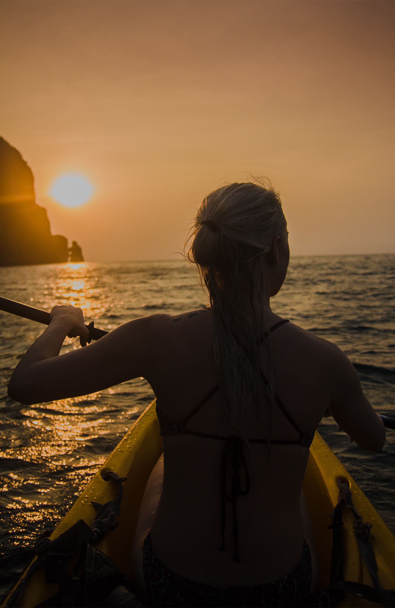 koh-phi-phi-woman-kayaking-sunset-sea-thailand