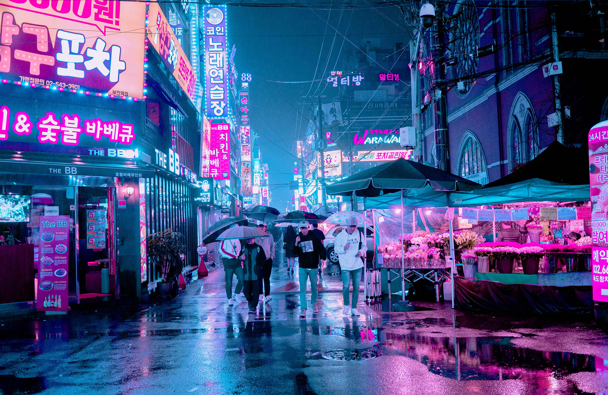 Neon city lights in the rain in the city centre of Seoul