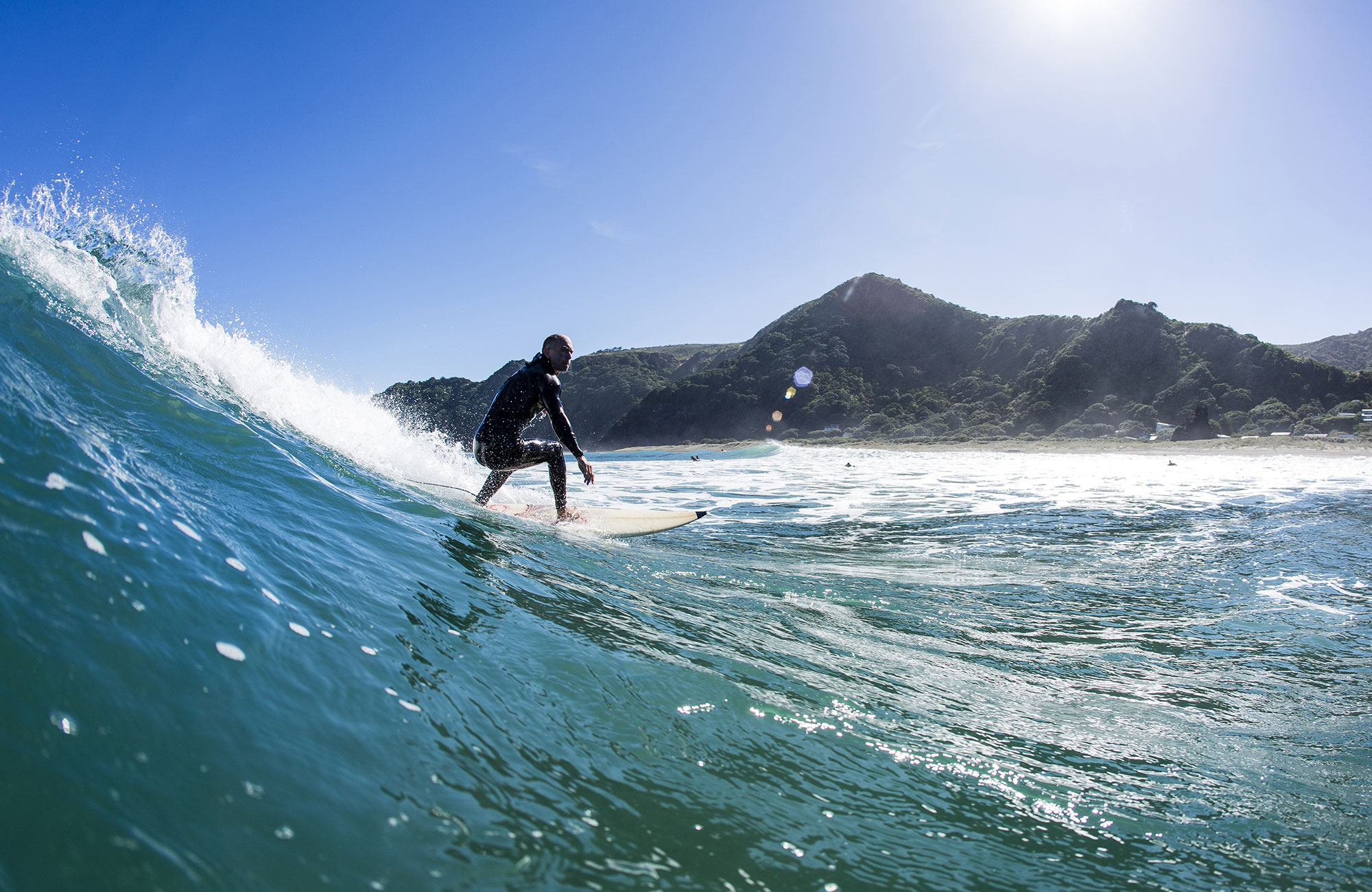 surfing-new-zealand-catching-wave