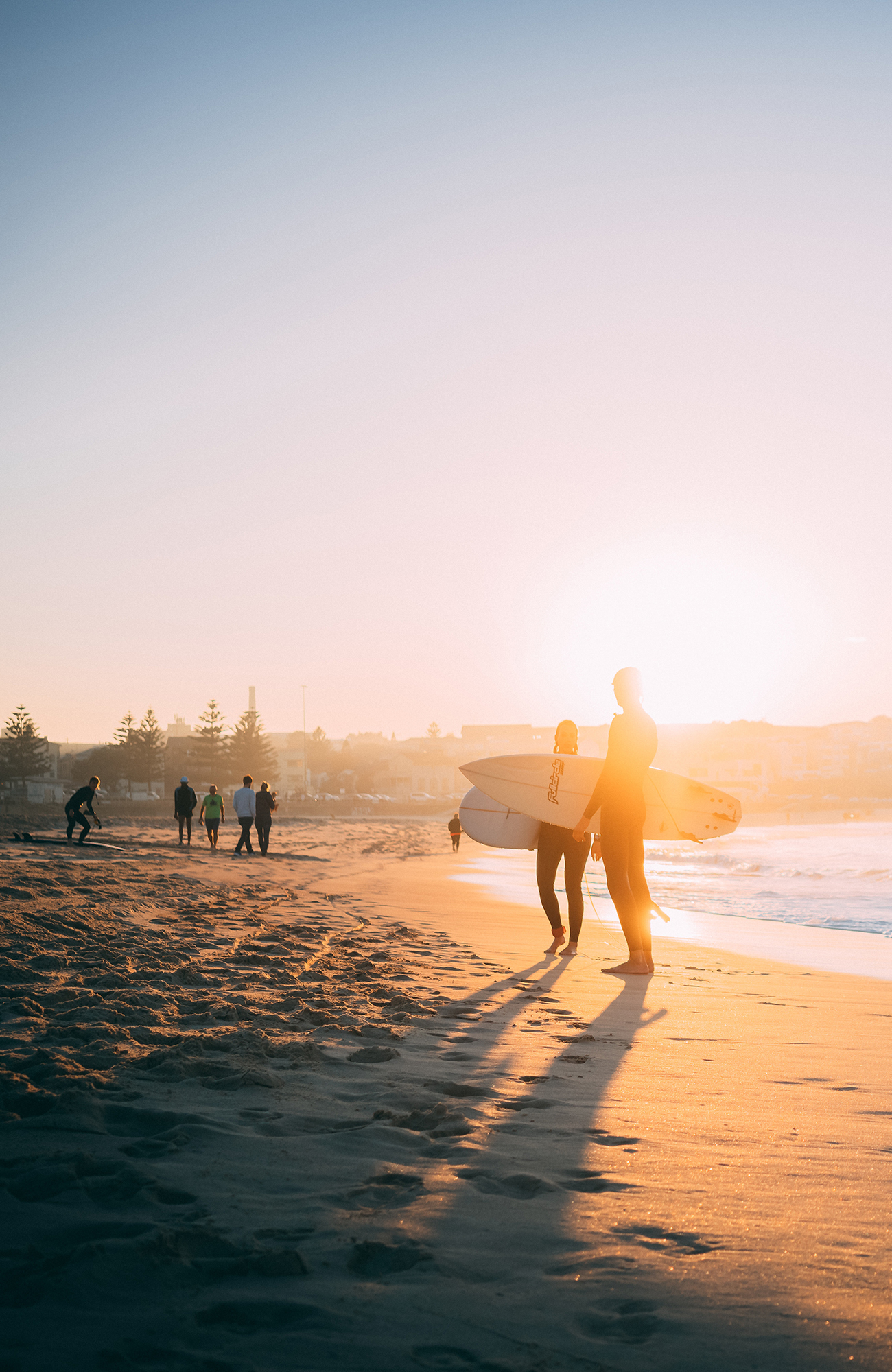 two surfers at the beach while studying in Sydney