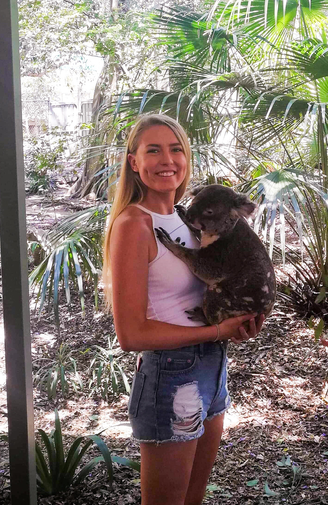malin a student at tafe in australia holding a koala
