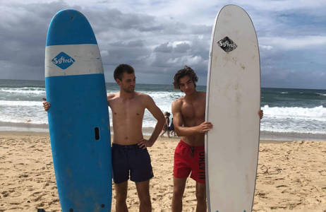 Oliver surfing with friends at University of the Sunshine Coast
