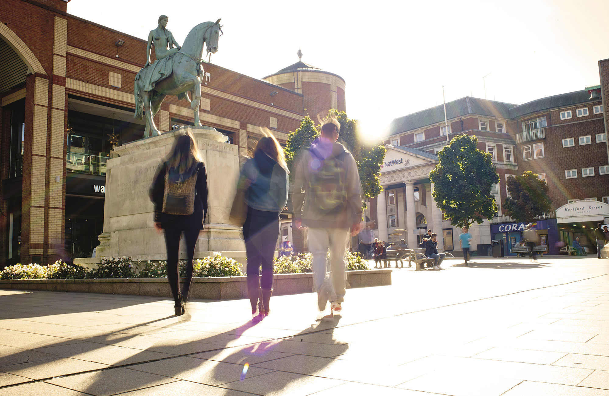 three students on campus of Coventry University