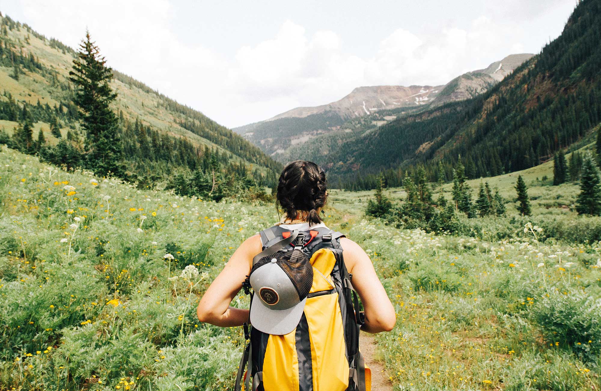girl trekking in beautiful landscape