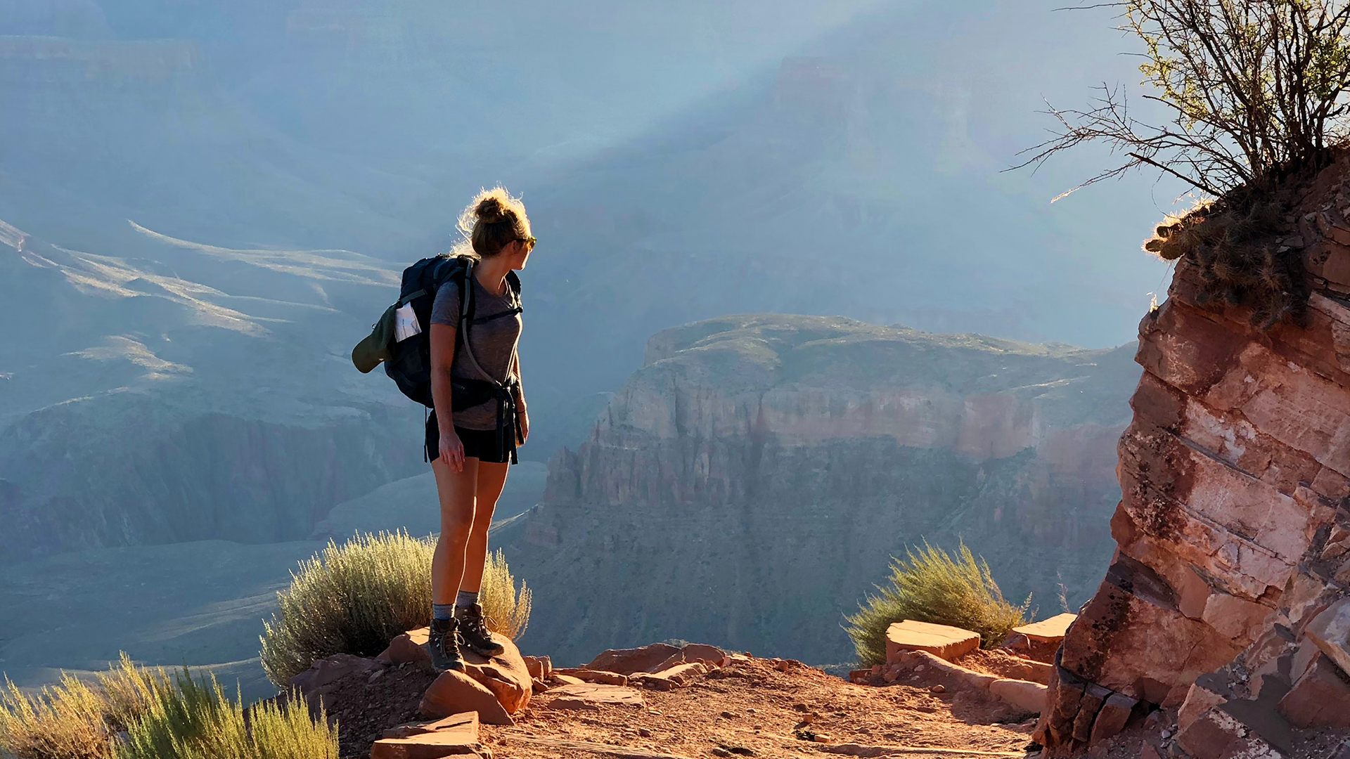 Girl Trekking With Backpack During Sunset (1)