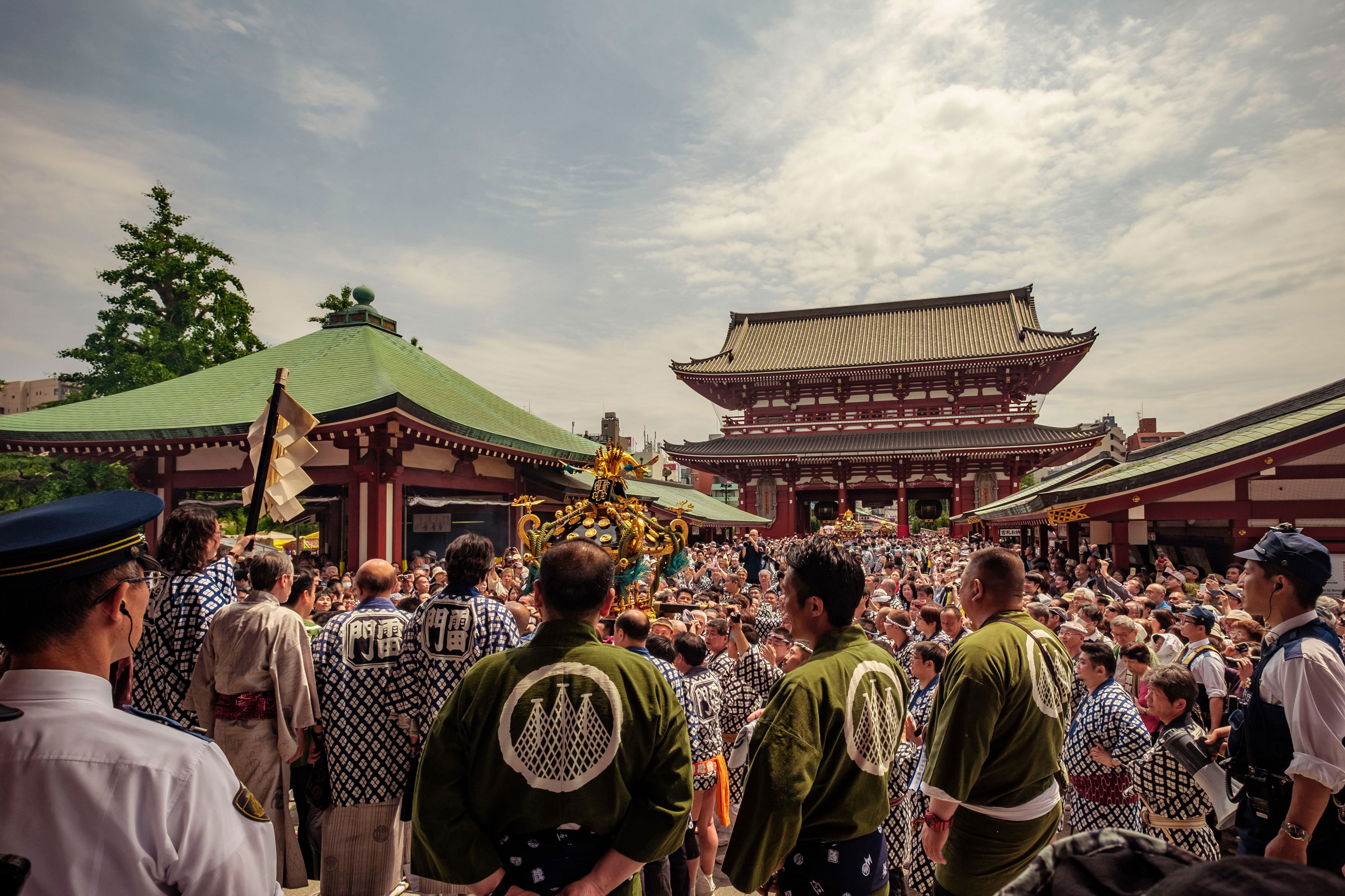 Large crowds dressed in traditional clothing at the Sanja Matsuri celebration at the Sensoji temple in central Tokyo