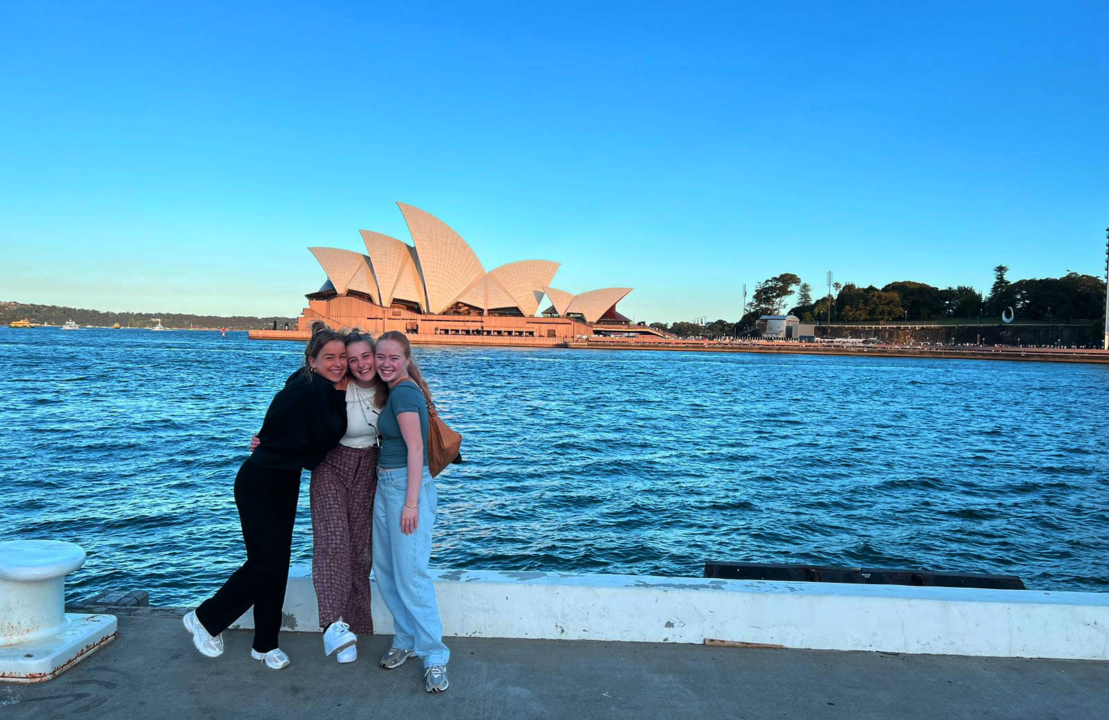 Amarins with two friends she met solo travelling in Australia, in front of the Sydney Opera House