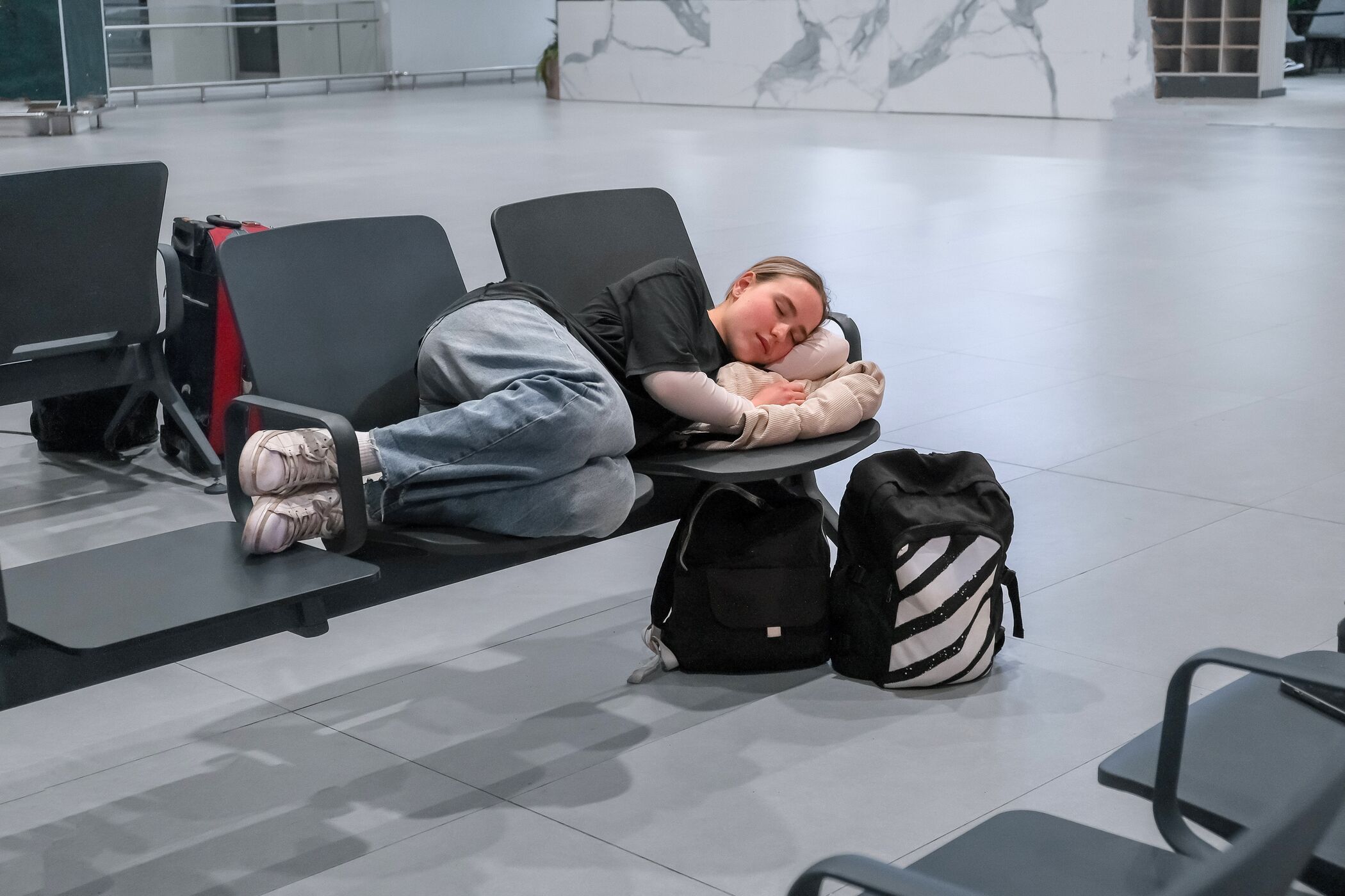 Woman Sleeping At Airport