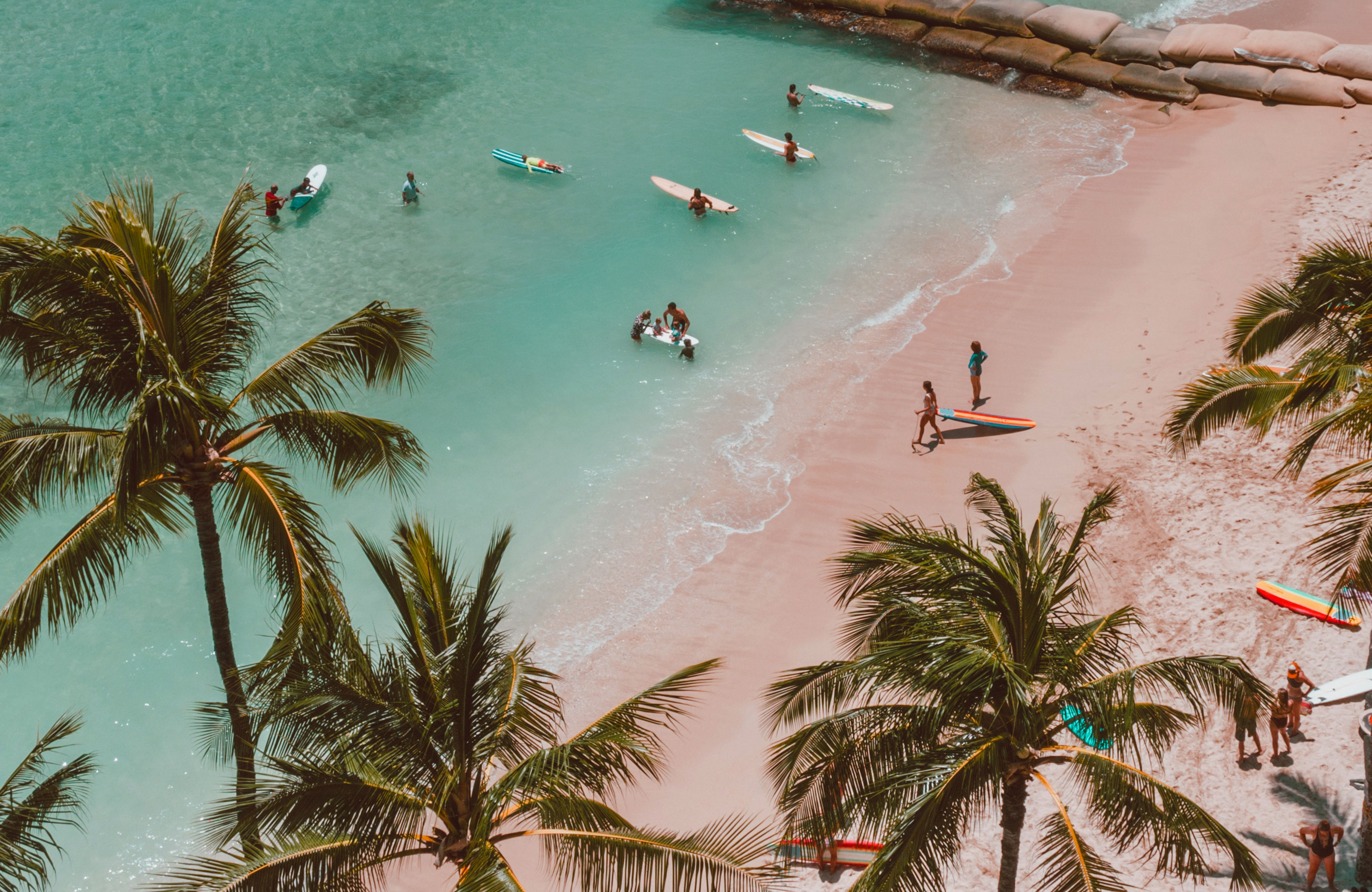 Surfers on a tropical beach in Hawaii