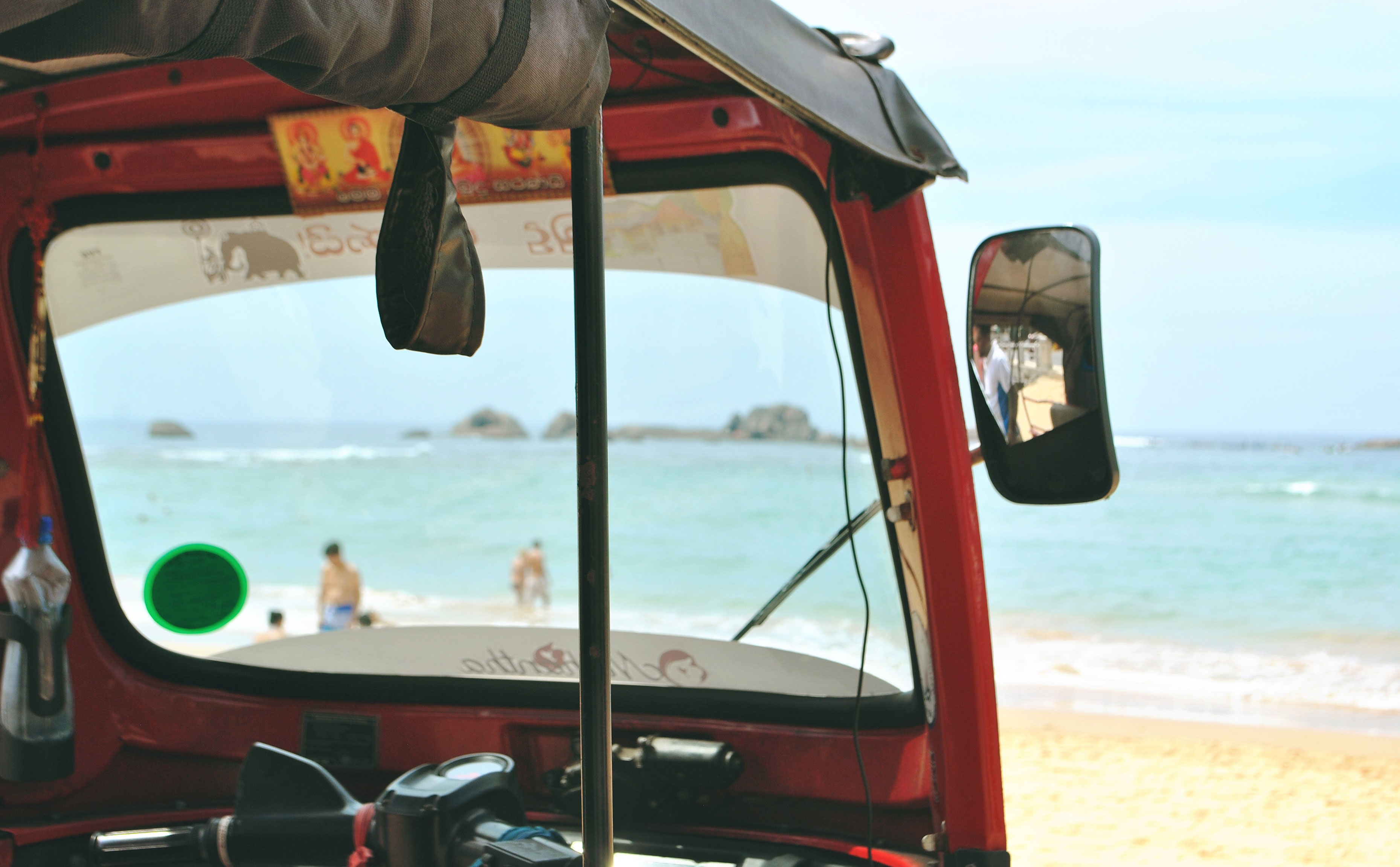 View of the beach in Ahangama, Sri Lanka, through a tuktuk window