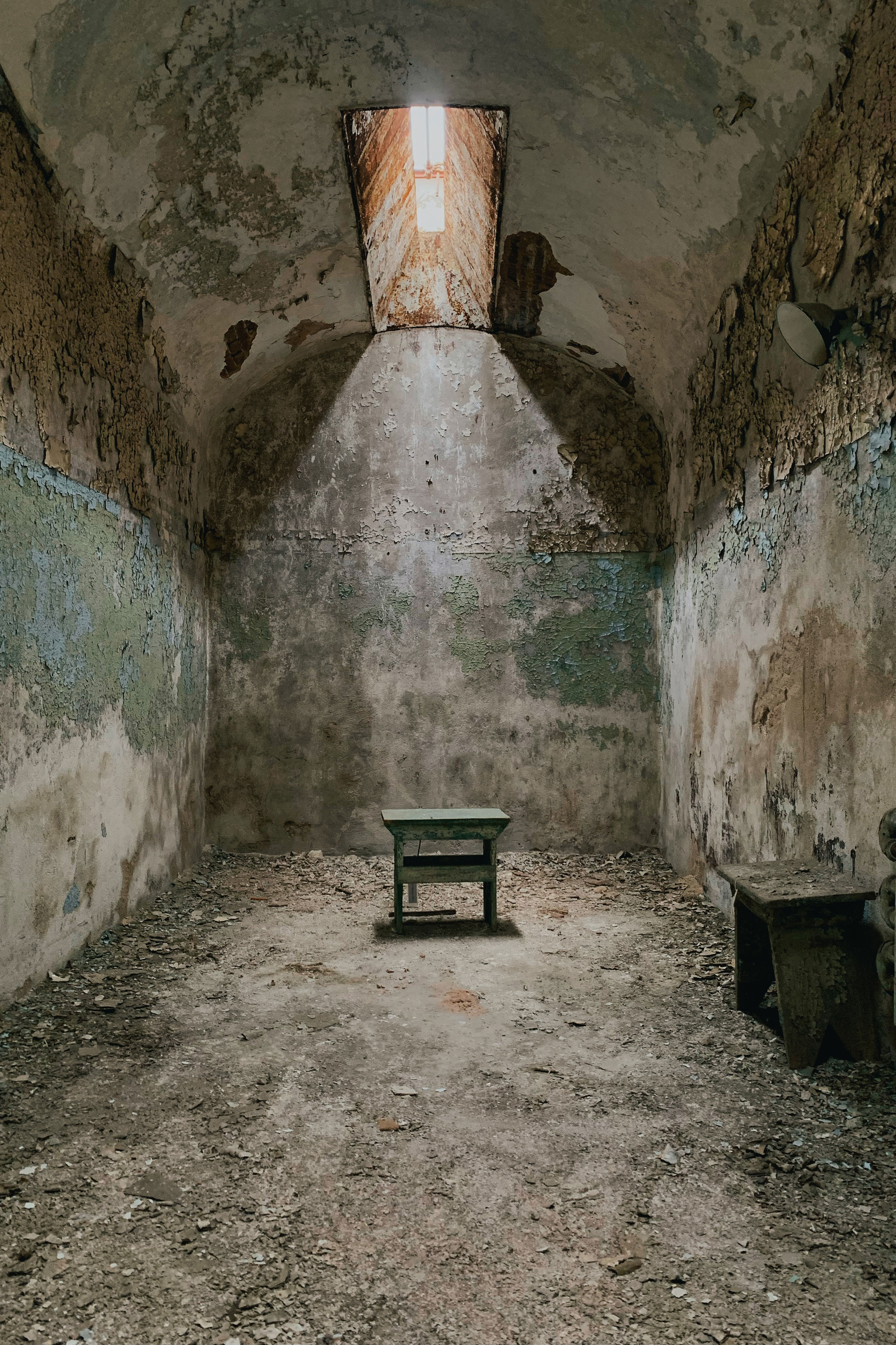 Run-down jail cell in Eastern State Penitentiary in Philadelphia, Pennsylvania